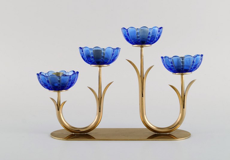 Gunnar Ander for Ystad Metall. Candlestick in brass and mouth-blown art glass shaped like flowers. 1950s.