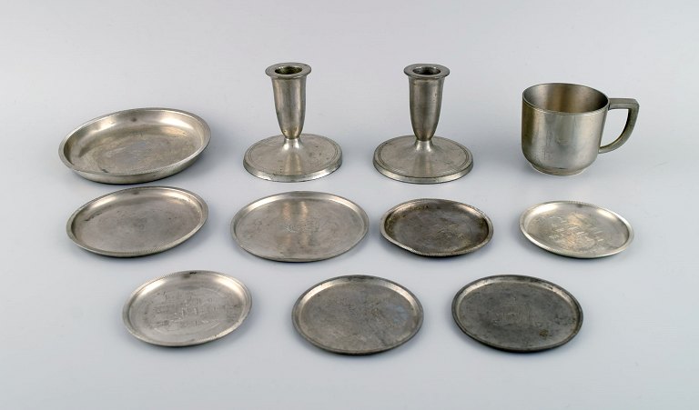 Just Andersen. Two candlesticks, eight bottle trays and a mug in pewter. 1930 / 40
