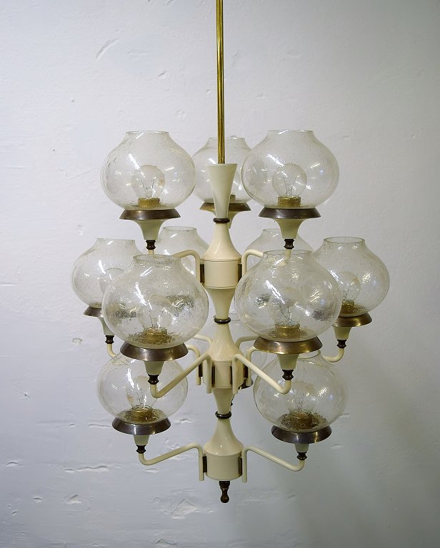Hans Agne Jakobsson for A / B Markaryd. Large impressive chandelier / ceiling 
lamp. Frame in partially lacquered brass with 11 screens in mouth-blown art 
glass. 1960s.
