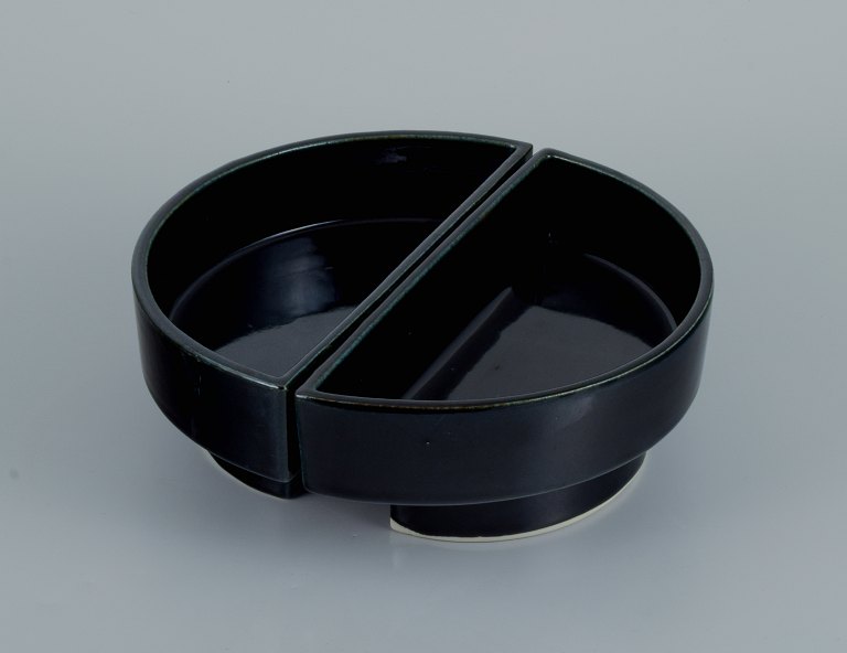 European studio potter. Two-piece unique bowl in black glaze.