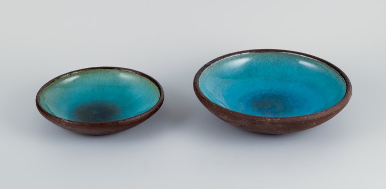OSA, Denmark.Two large retro unique ceramic bowls with glaze in turquoise tones.