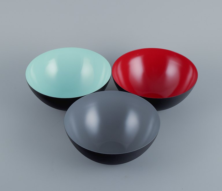 Three bowls in metal.Grey, red and mint green.