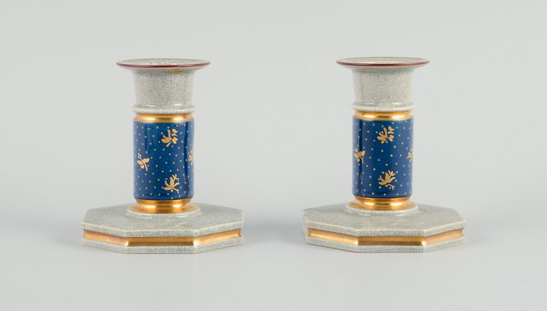 Royal Copenhagen, a pair of candlesticks in cracked porcelain.Hand painted with gold edge.