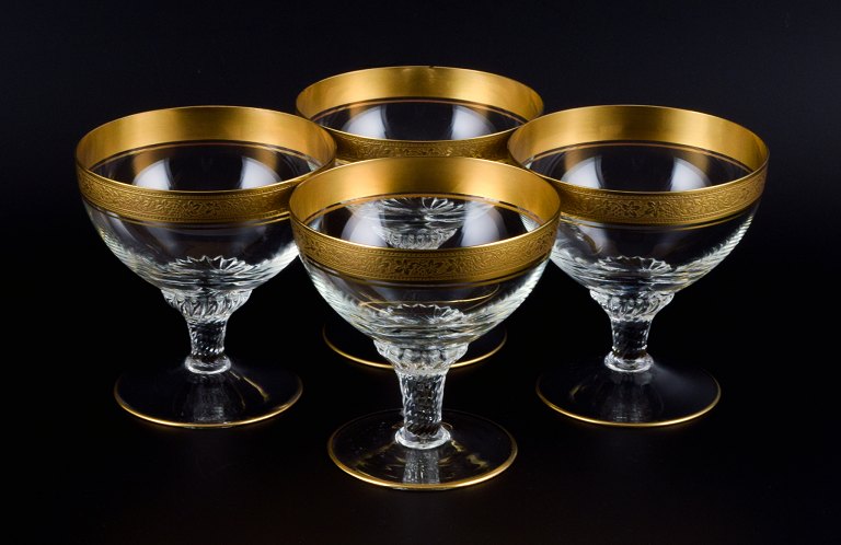 Rimpler Kristall, Zwiesel, Germany, four mouth-blown crystal champagne glasses with gold rim decorated with grapes and vine leaves.