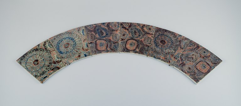 Royal Copenhagen, six Baca faience tiles with patterned glaze in brown, blue and green.