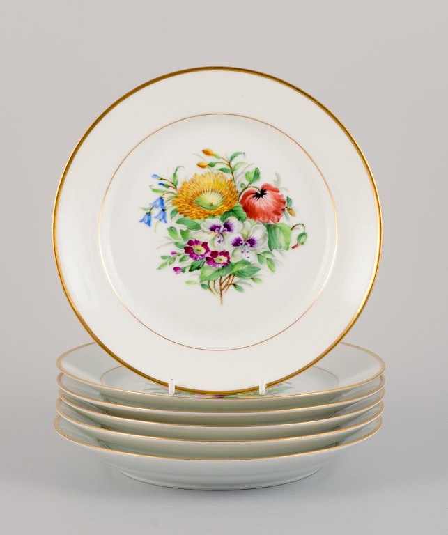Bing & Grøndahl, six porcelain lunch plates hand-painted with polychrome flowers and gold decoration.