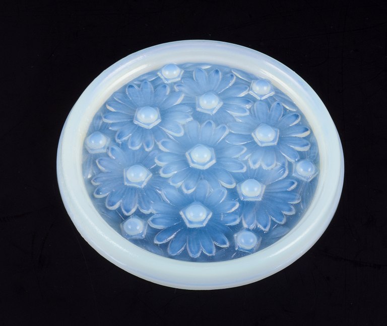 Sabino, France. A dish in art glass with raised flower motifs. Art Deco opaline glass with a bluish tint.