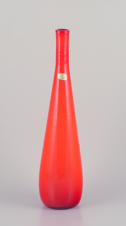 Murano, Italy. Large art glass vase with a slender neck in orange mouth-blown glass.