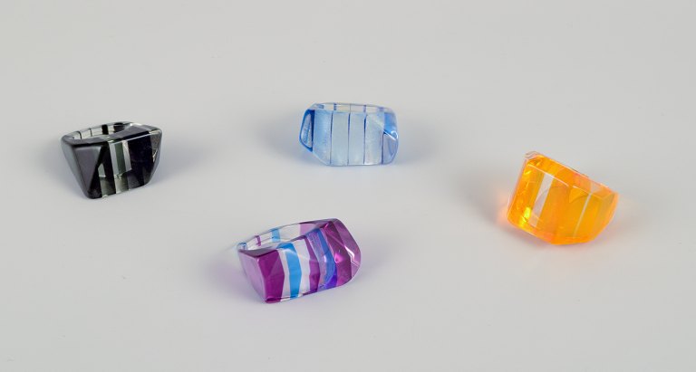 French jewelry artist. Four designer rings in plastic. Striped design with various colors.