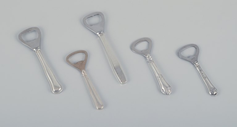 Evald Nielsen, Cohr, and other Danish silversmiths.Five bottle openers in 830 silver and sterling silver.