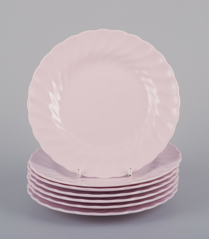 Tuscan, England. Seven plates in light pink porcelain with a wavy edge.Fine English bone China.