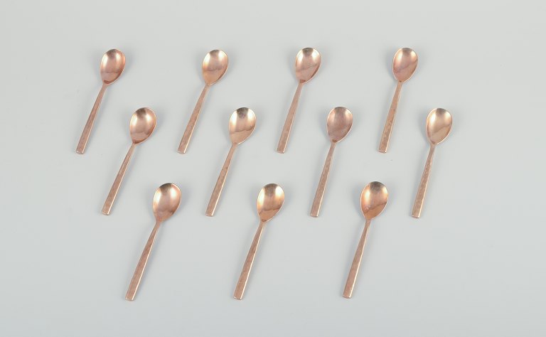 Scandinavian designer. A set of eleven coffee spoons in handcrafted hammered brass. High-quality craftsmanship.