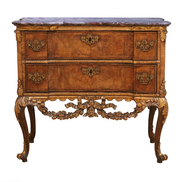 Walnut veneered and partly gilt marble top commode made by the manufacture 
Köster, Altona, Northgermany, circa 1770. H: 78cm. Top: 85x43cm