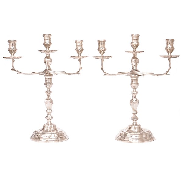Pair of sterlingsilver Rococostyle candelabra by A. Michelsen, Copenhagen, 1951. 
H: 35,5cm. W: 2.053gr