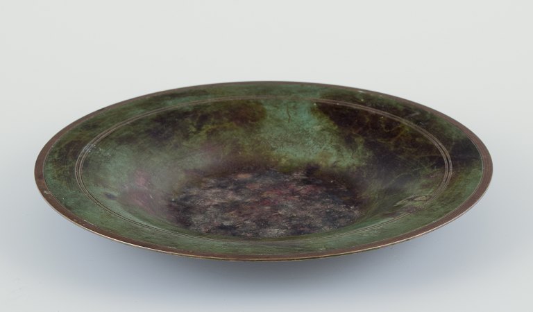 Just Andersen.
Skål i legeret bronze.