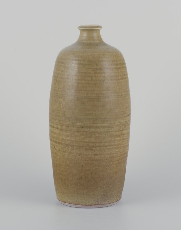 Danish studio ceramicist.
Ceramic vase with aubergine glaze.