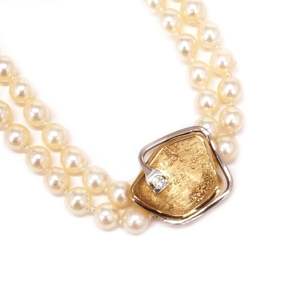 Ole Lynggard Schliesse aus 14kt Gold mit einem Brillanten von etwa 0,1ct. Grösse: 20x20mm