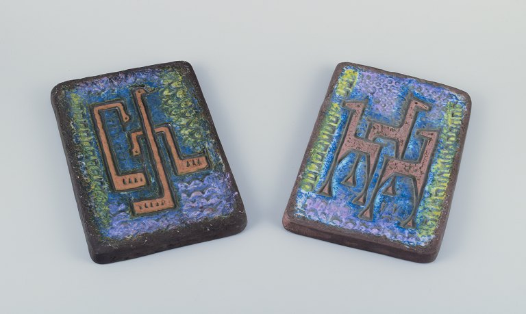 Berth Ferdinand Norrman, Motala, Sweden.
A pair of wall reliefs of glazed stoneware.