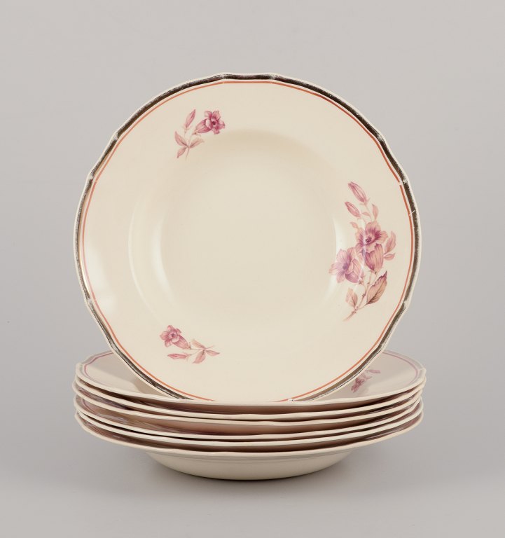 Arabia, Finland.
A set of seven deep ‘Myrna’ faience plates.