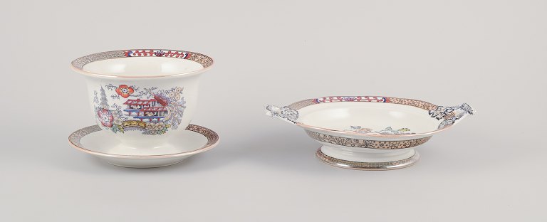 Rörstrand, Sweden. ‘Japan’ sauce bowl on foot and centerpiece with two handles. 
Faience.