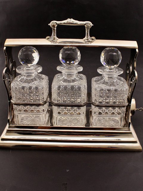 Tantalus in silver-plated holder with 3 cut crystal decanters