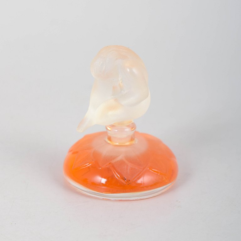 René Lalique, perfume bottle with nude female figure.