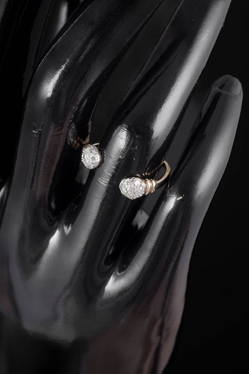 9 carat gold ring with white stones.